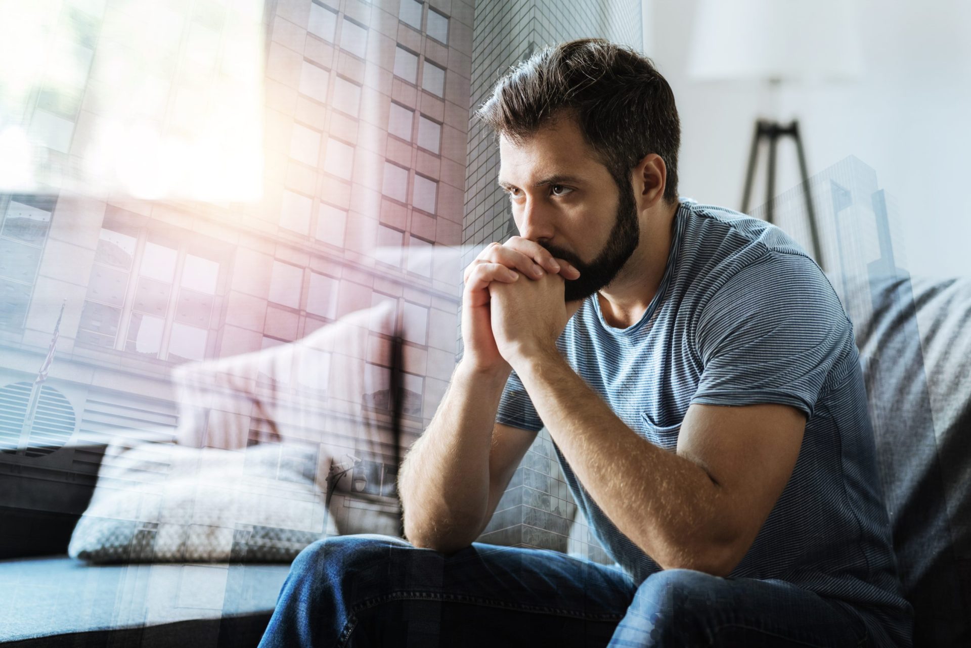 Thoughtful serious man sitting and thinking.