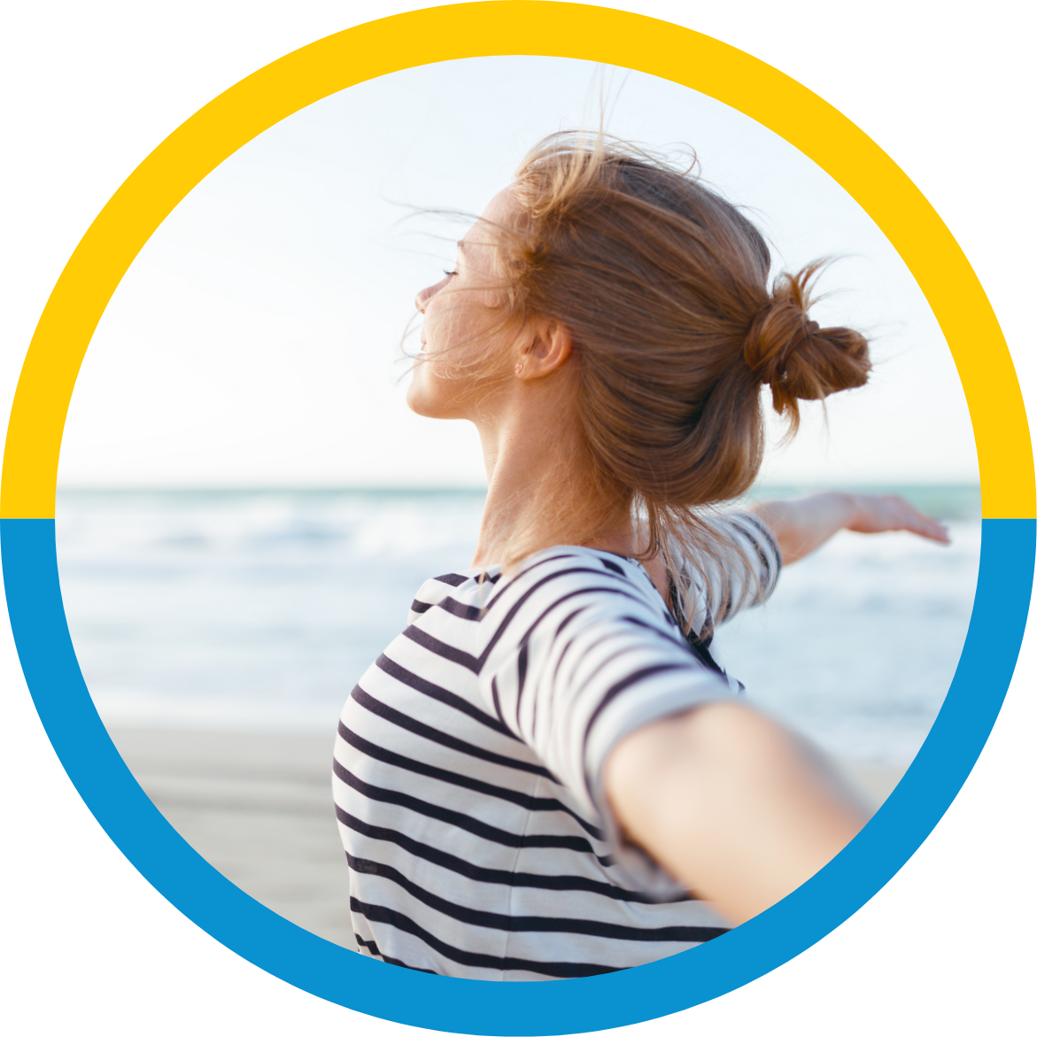woman feeling happy and light at the ocean