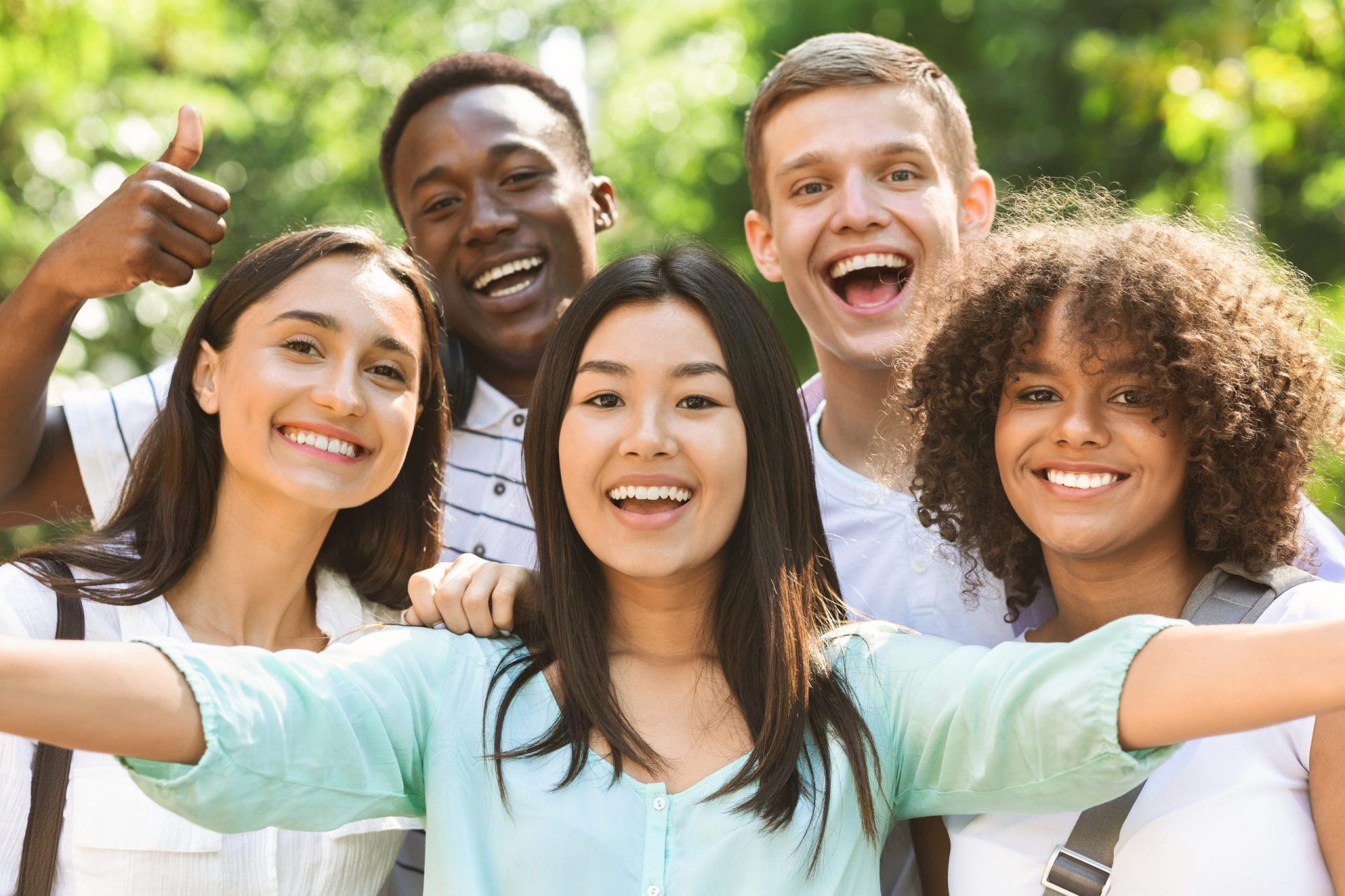 shutterstock_1661336080 Happy college aged young adult friends