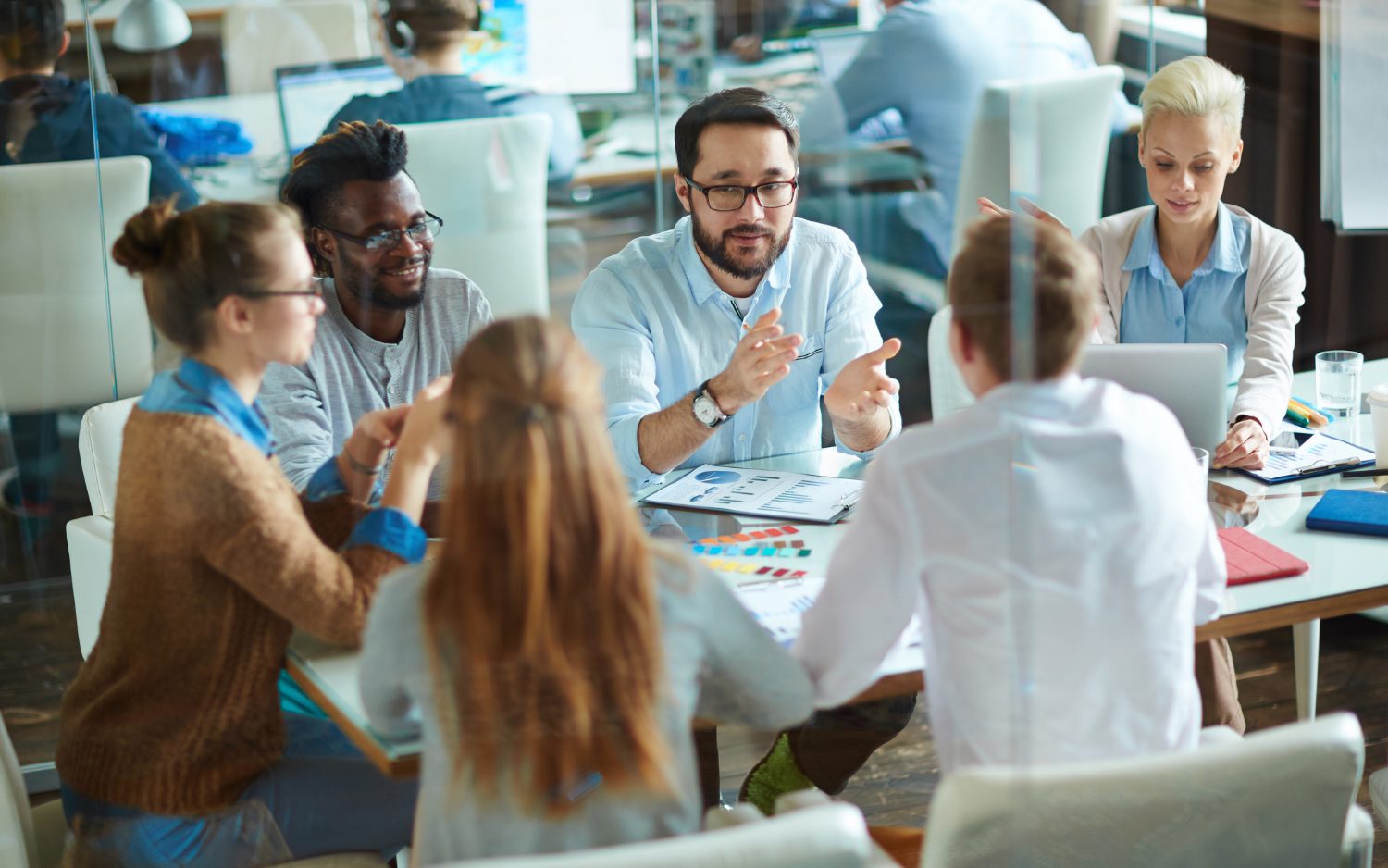 Group of employees sitting around a table