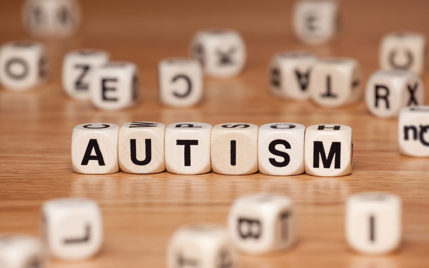 autism letter blocks lined up spelling the word autism