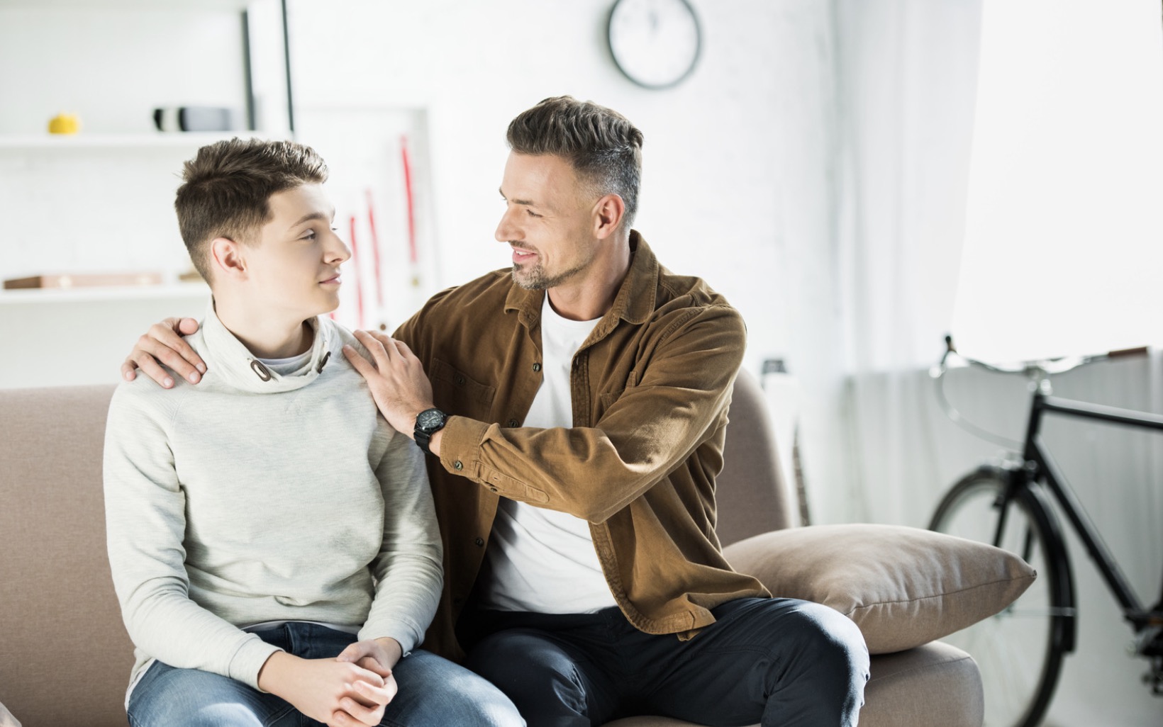 Father talking to teenage son