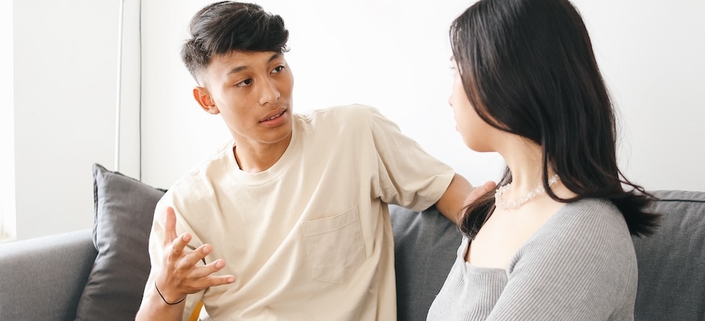 Teenage boy talking to his mother