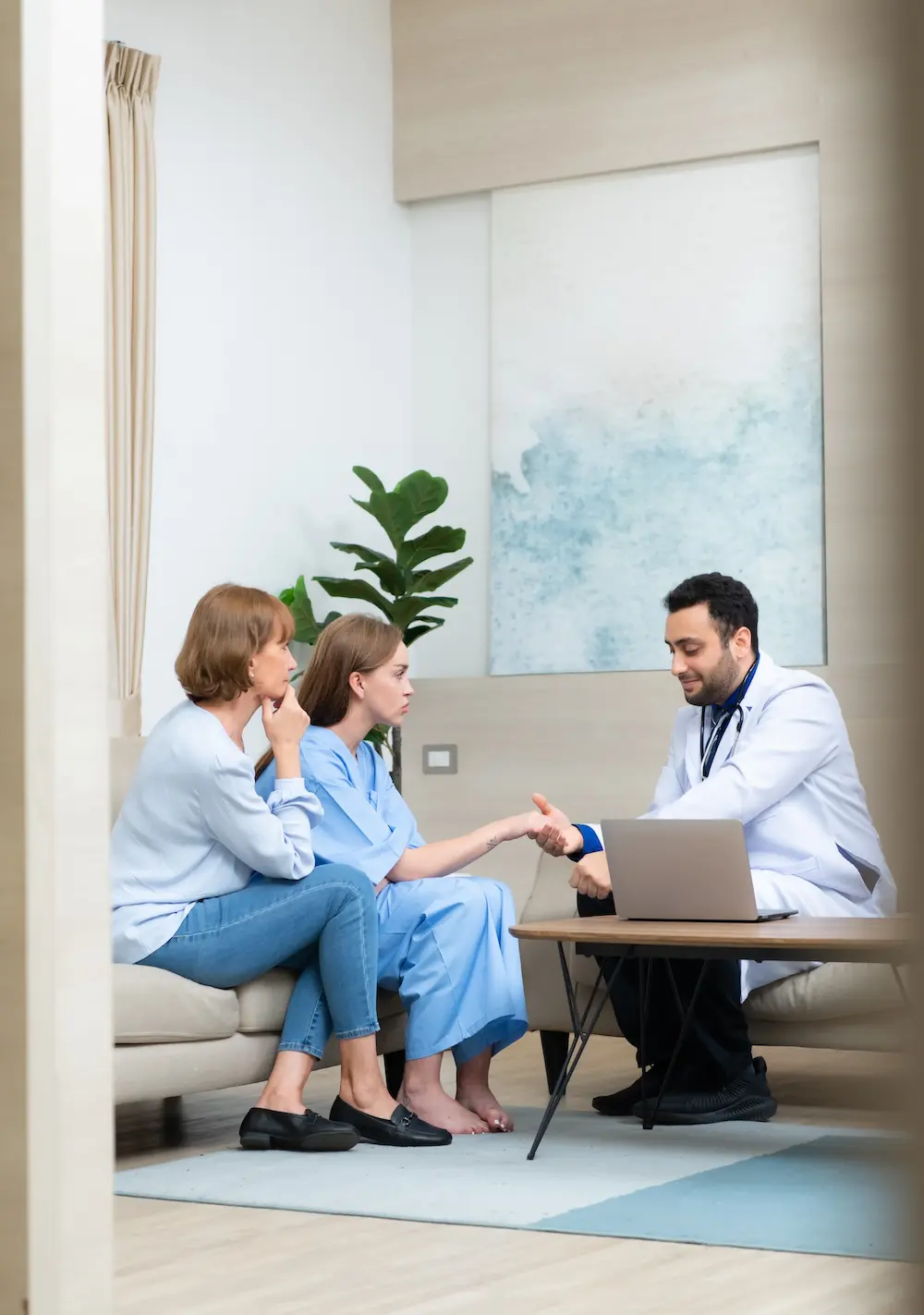 alternative to inpatient mental health treatment - patient and mother sitting in waiting room with doctor