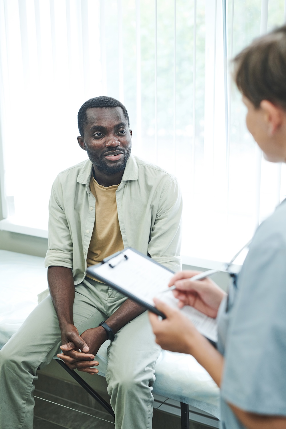 Patient talking to doctor about treatment plan.