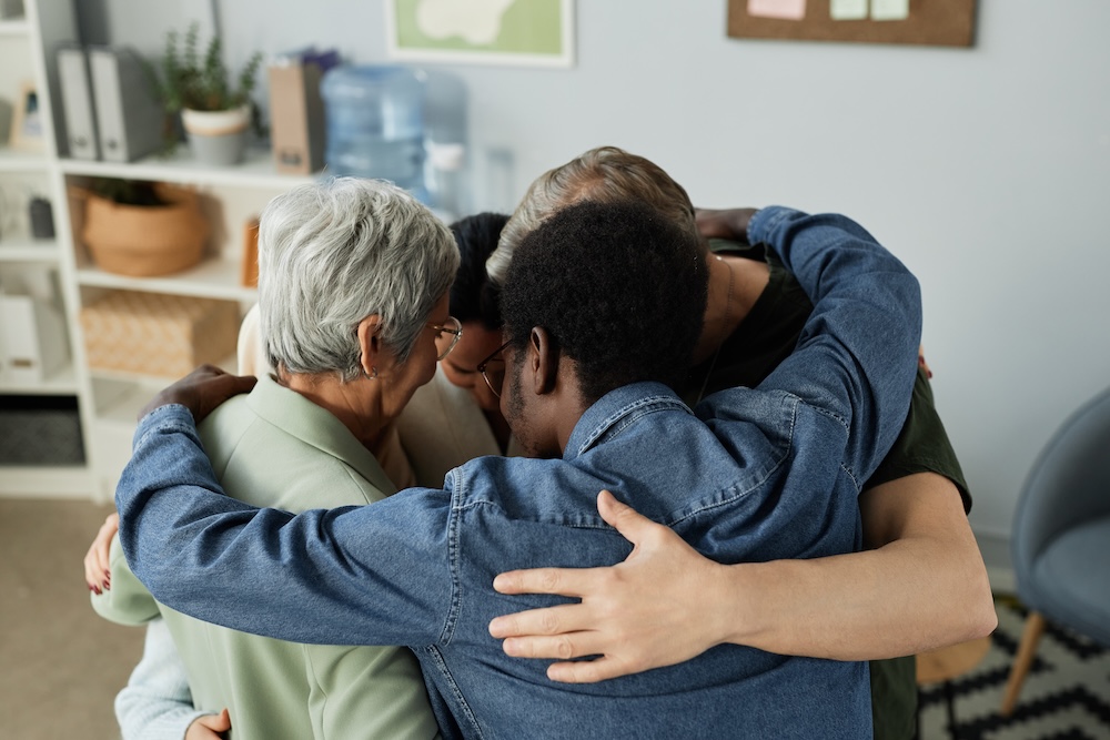 Family embracing as a group